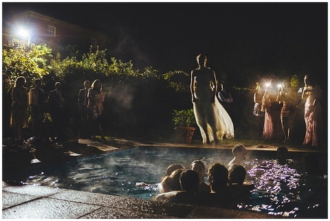 Bride jumping in the swimming pool
