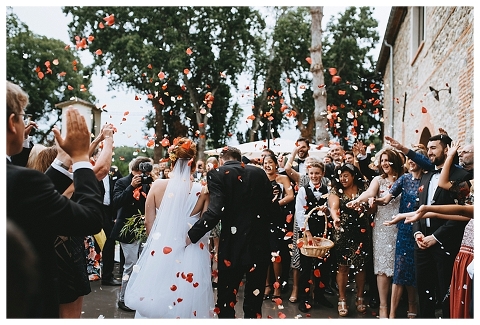 Guests throwing petals 